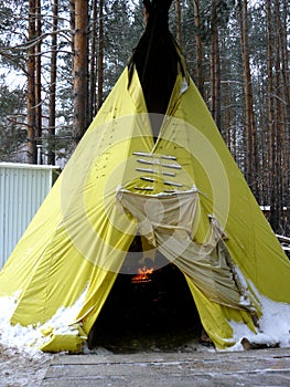 Yellow Wigwam in the winter forest