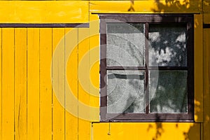 Yellow wood background with window