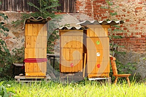 Yellow wooden beehive