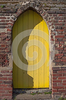 Yellow wooden cottage door