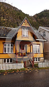 Yellow wooden House in Autumn colours in Valldal n Norway