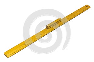 Yellow wooden measuring ruler on a white background