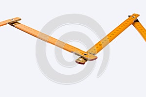 Yellow wooden ruler isolated on white background.