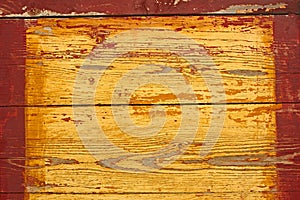 Yellow wooden shield with red frame