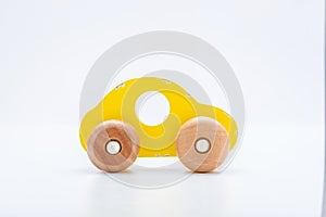 Yellow wooden toy car