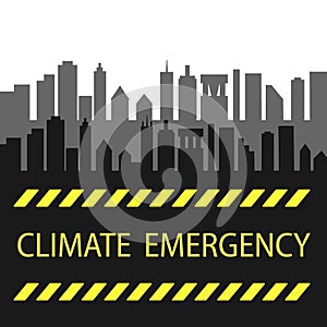 Yellow words Climate Emergency on a black city background. Danger, attention, environmental pollution of water, air, ecological pr photo