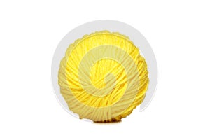 Yellow yarn ball over white