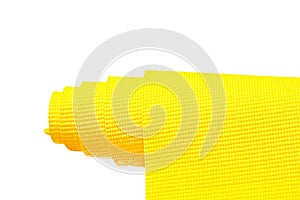 Yellow yoga mat isolated on white background