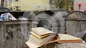 Yellowed Book and Dumpster