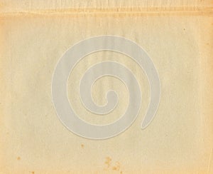 yellowing page of old book vintage paper with stains background texture