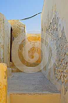 Yellowish alley in Oia, Santorini, Greece