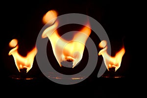 Yellowish fire flames with dark background