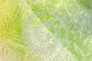 Yellowish green glitter background photo