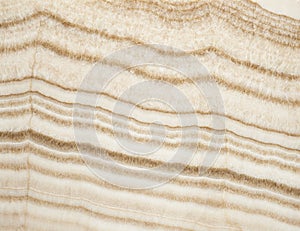 Yellowish layered onyx stone texture. For background