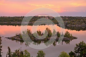 Yellowknife with Small Rocky Island in Frame Lake in Dramatic Evening Light, Northwest Territories, Canada