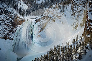Yellowstone Canyon waterfall with illuminated mist