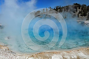 Yellowstone National Park with Steam rising from Excelsior Geyser at Midway Geyser Basin, Wyoming, USA