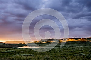 Yellowstone River Meanders Through Hayden Valley At Sunset