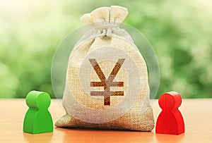 Yen yuan money bag and a deal between two persons. Business lending, leasing. Trade agreement. Negotiation process dealings. photo