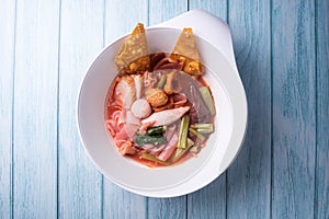 Yentafo noodle in the bowl put on wood table asia food