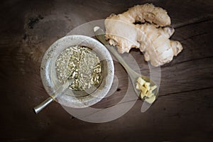 yerba mate and ginger for infusion on rustic wooden background