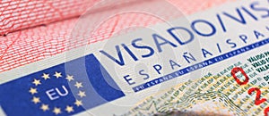 Yerevan, Armenia, December 25, 2023: Closeup Spain visa focusing on the word VISA. Schengen visa stamp background