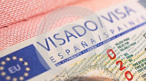 Yerevan, Armenia, December 25, 2023: Closeup Spain visa focusing on the word VISA. Schengen visa stamp background