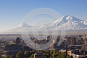 Yerevan, capital of Armenia at the sunrise with the two peaks of the Mount Ararat on the background.