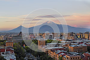 Yerevan, capital of Armenia at the sunrise with the two peaks of the Mount Ararat on the background.