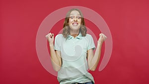 Yes	 I am champion! Enthusiastic overjoyed ecstatic young woman in t-shirt shout