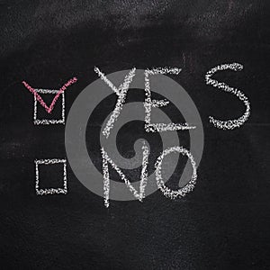 Yes or No on black chalkboard