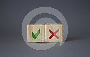 Yes vs No symbol. Wooden cubes with words YES and No. Beautiful grey background. Business concept. Copy space