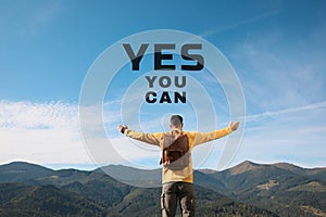 Yes You Can. Motivational quote inspiring to believe in yourself. Text over man in mountains on sunny day