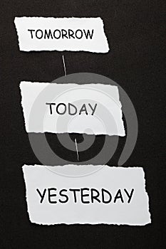 Yesterday Today Tomorrow text on 3 piece of torn paper