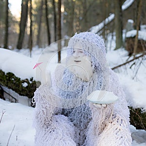 Yeti fairy tale character in winter forest. Outdoor fantasy photo.