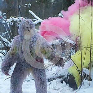 Yeti fairy tale character in winter forest. Outdoor fantasy photo.