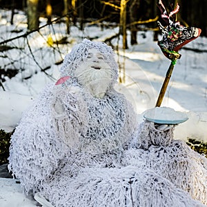 Yeti fairy tale character in winter forest. Outdoor fantasy photo.