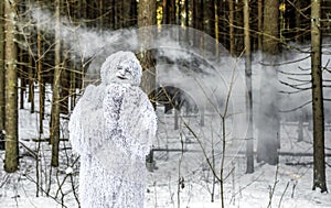 Yeti fairy tale character in winter forest. Outdoor fantasy photo.