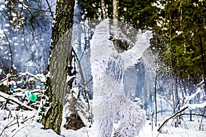 Yeti fairy tale character in winter forest. Outdoor fantasy photo.