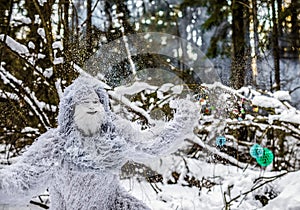 Yeti fairy tale character in winter forest. Outdoor fantasy photo.