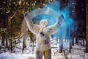 Yeti fairy tale character in winter forest. Outdoor fantasy photo.