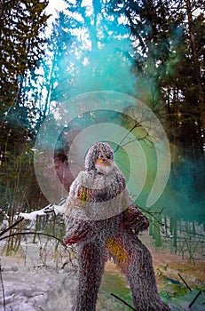 Yeti fairy tale character in winter forest. Outdoor fantasy photo.