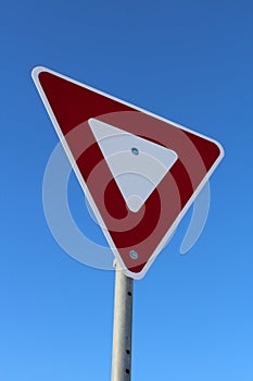 Yield Sign Against Blue Sky