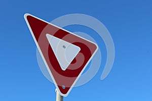 Yield Sign Against Blue Sky