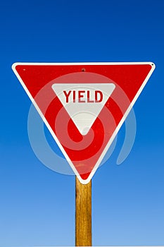 Yield Sign at the highway with blue sky