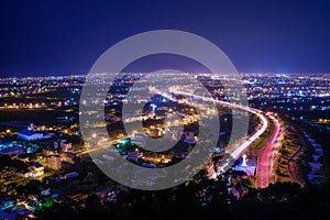 Yilan County Night View - City skyline with car light trails at night in Yilan, Taiwan.