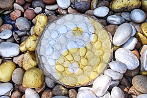 Yin and Yang stone yellow and white paint abstract on backgroound