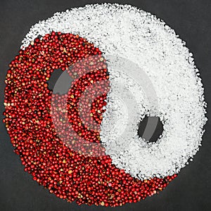 Yin Yang symbol made from red pepper and salt