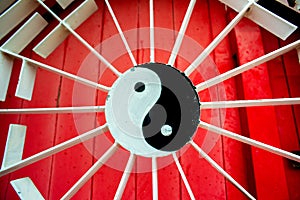 Yin and Yang Symbol on Red and White Gate