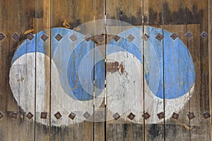 The Ying Yang sign painted on wooden door